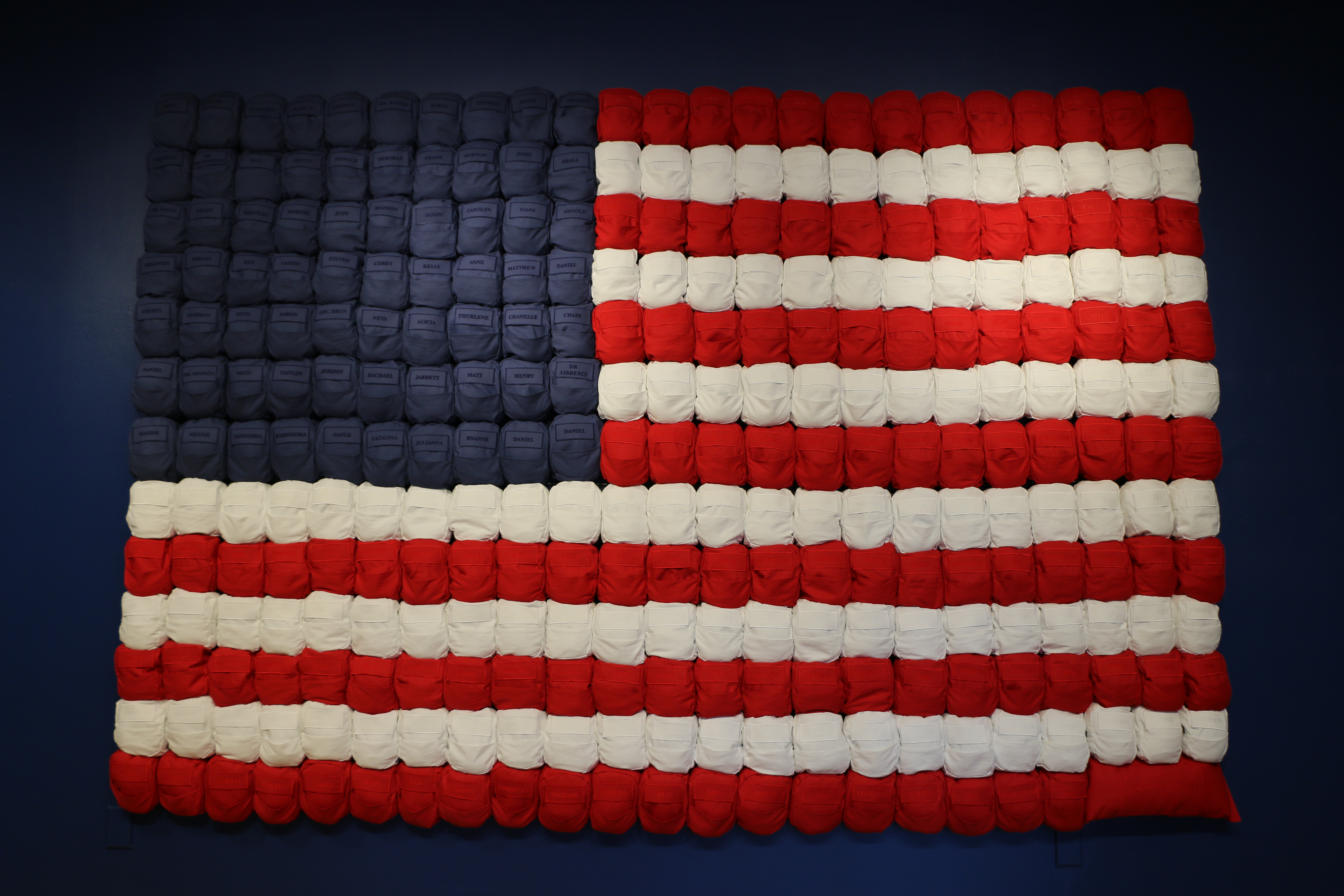 American Exceptionalism backpack installation arranged as an American flag
