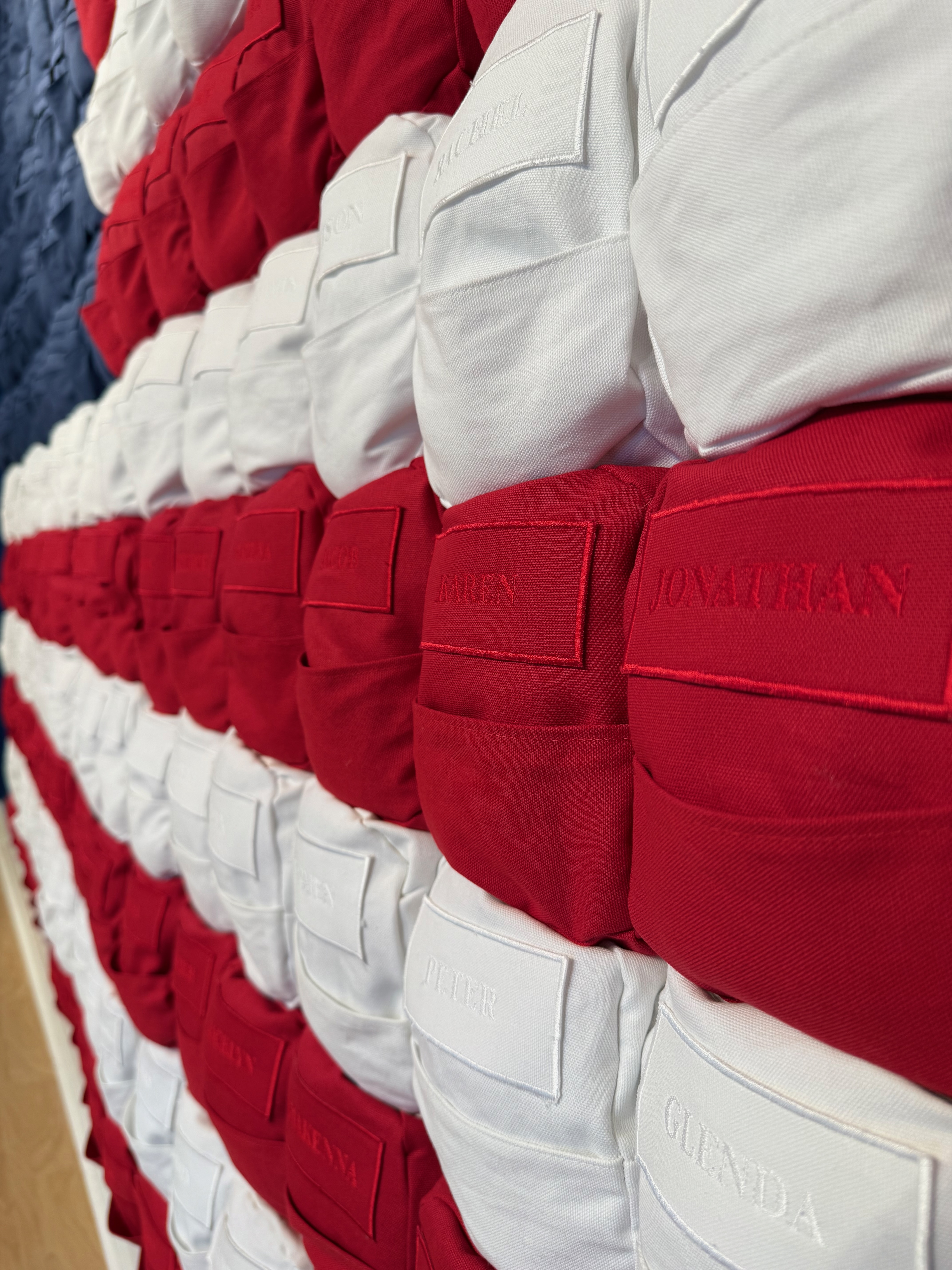 Detail of embroidered backpack from installation